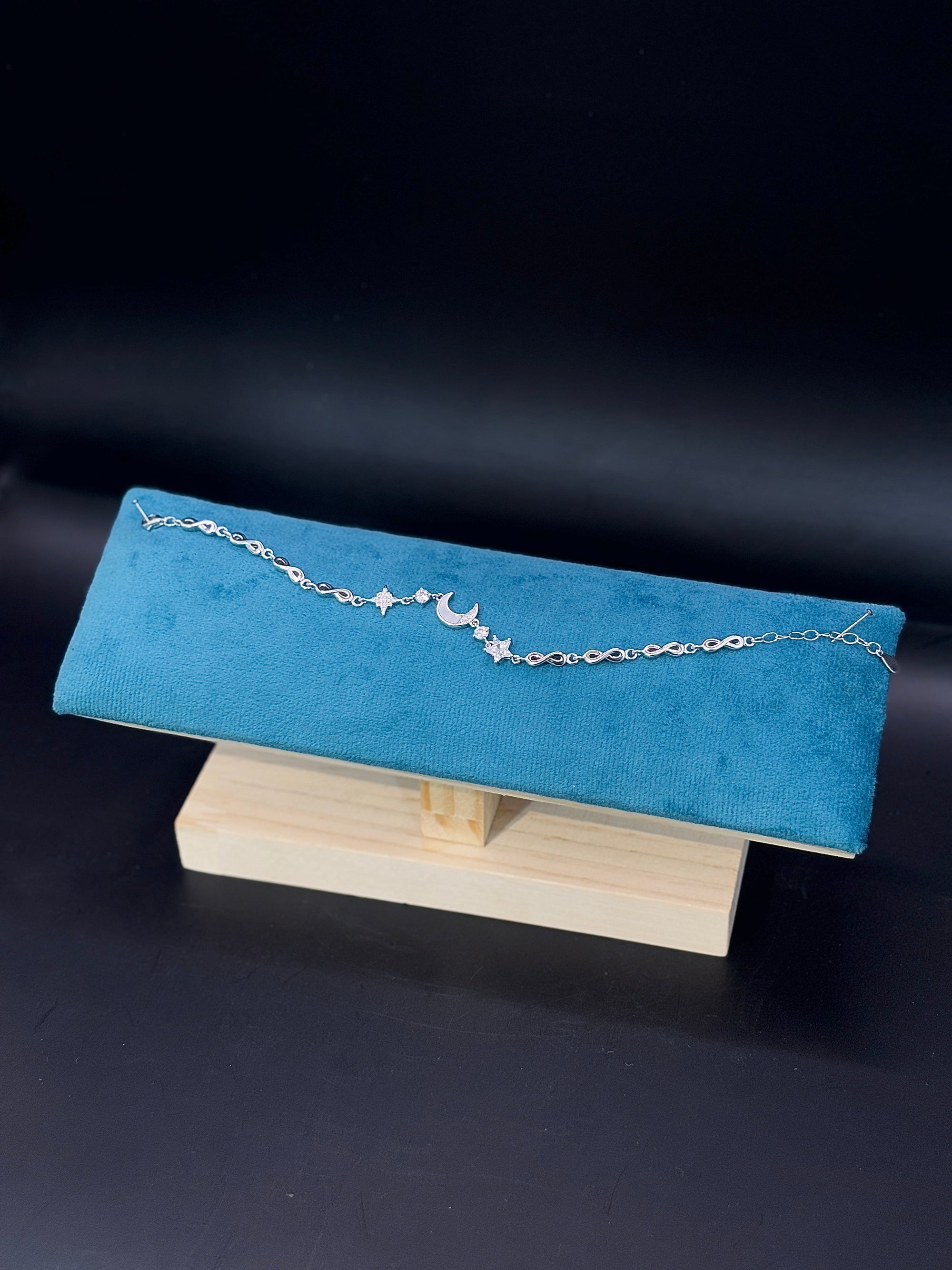 Celestial Charm Bracelet Featuring Moon and Star TISA Silver Elegance