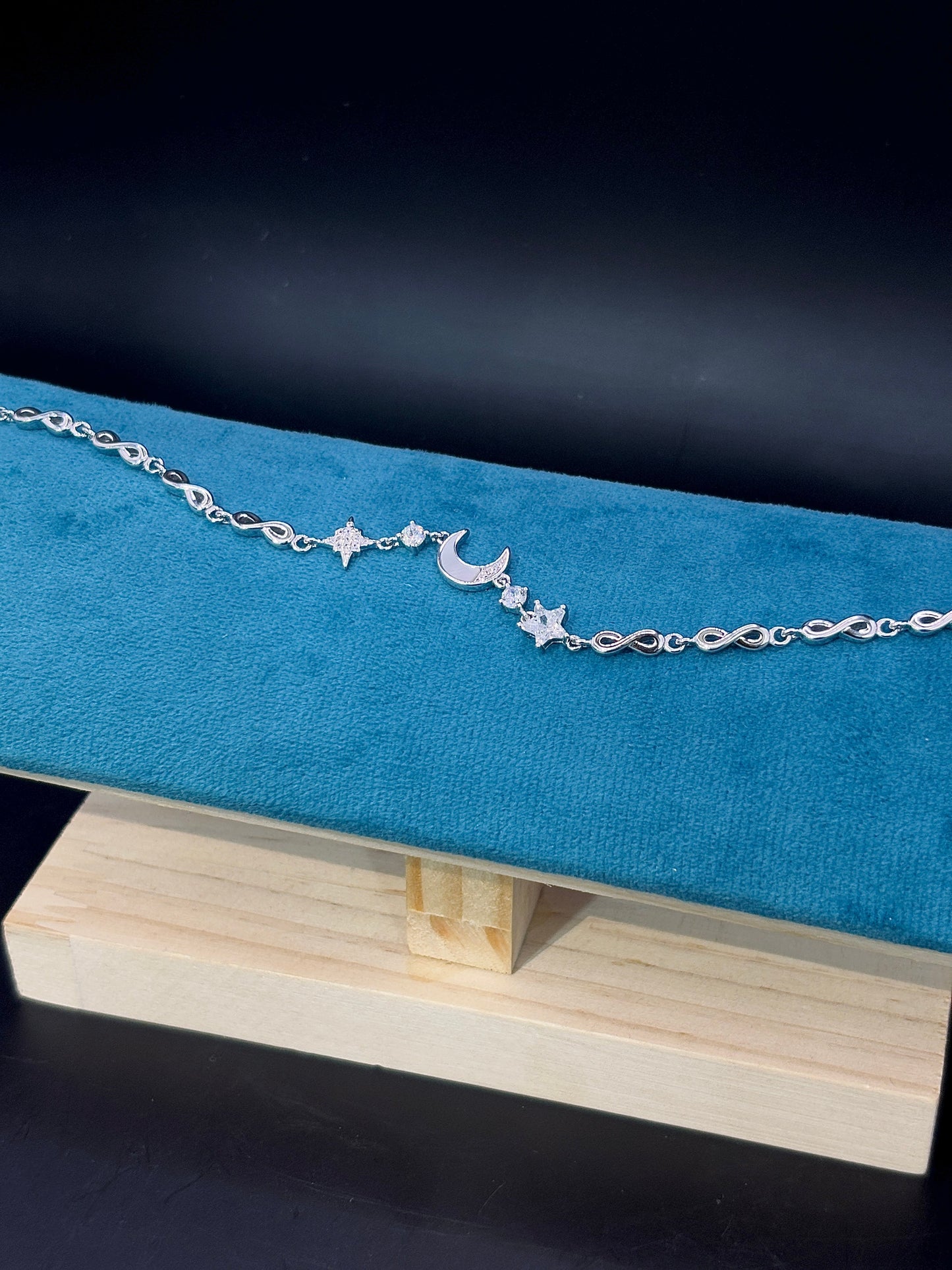 Celestial Charm Bracelet Featuring Moon and Star TISA Silver Elegance